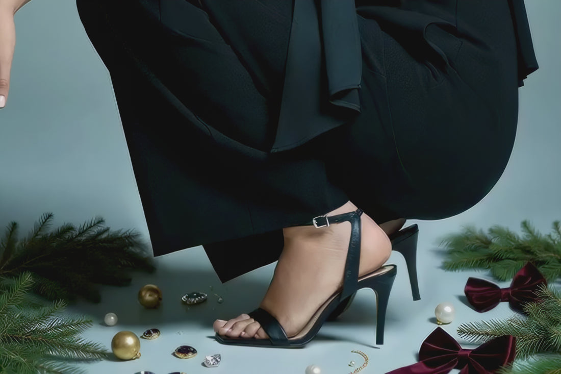 woman in black wearing high heel occasion shoes on light blur background 